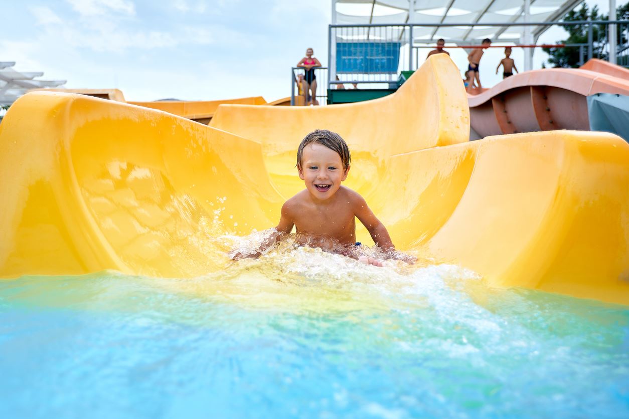 Wateraprk and child on water slide